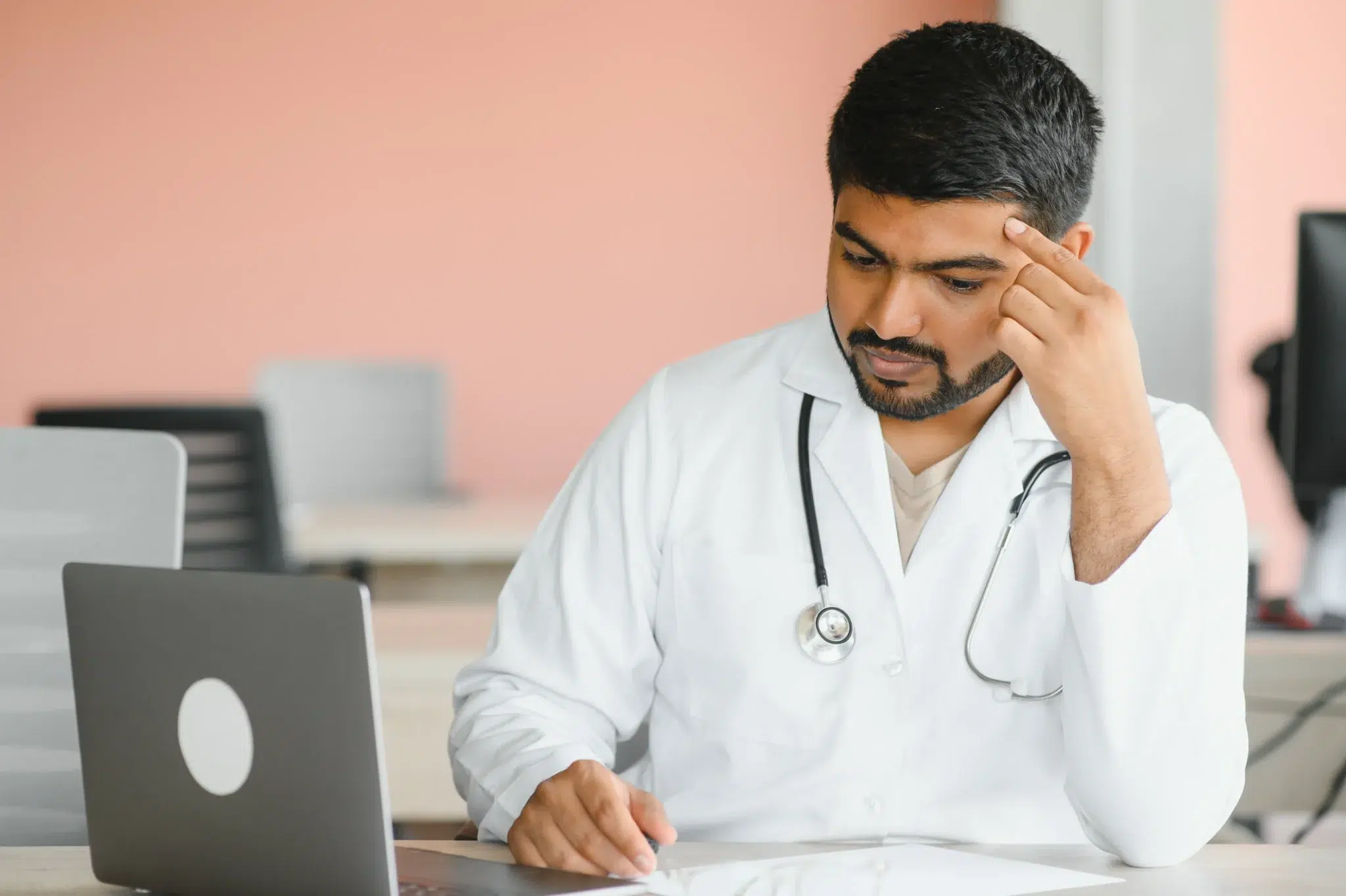 upset depressed indian male medical student doctor