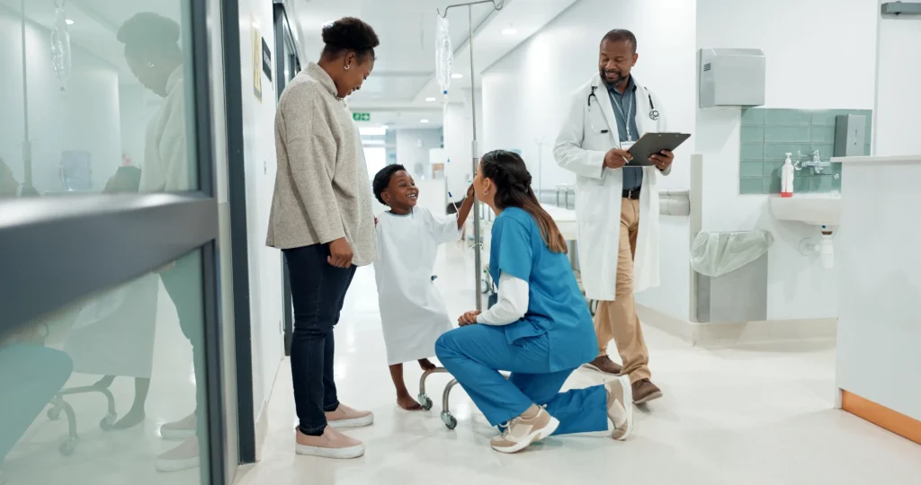 mother and child with doctors Family Medicine physician with patient reflecting growing demand and IMG representation in primary care